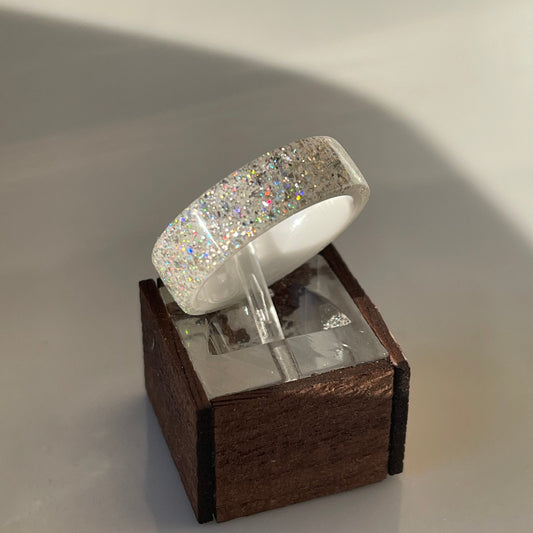 Moissanite DiamondCast Ring on a White Ceramic Band