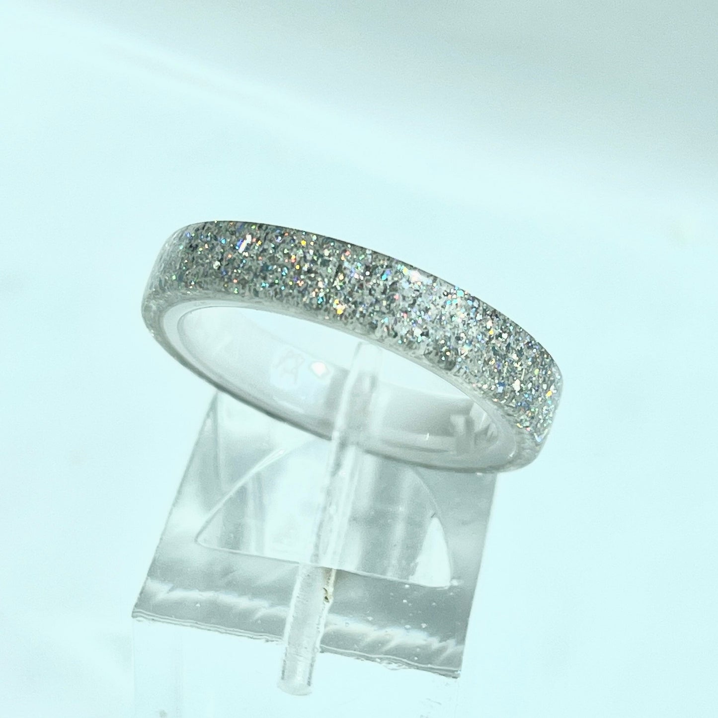 Moissanite DiamondCast Ring on a White Ceramic Band