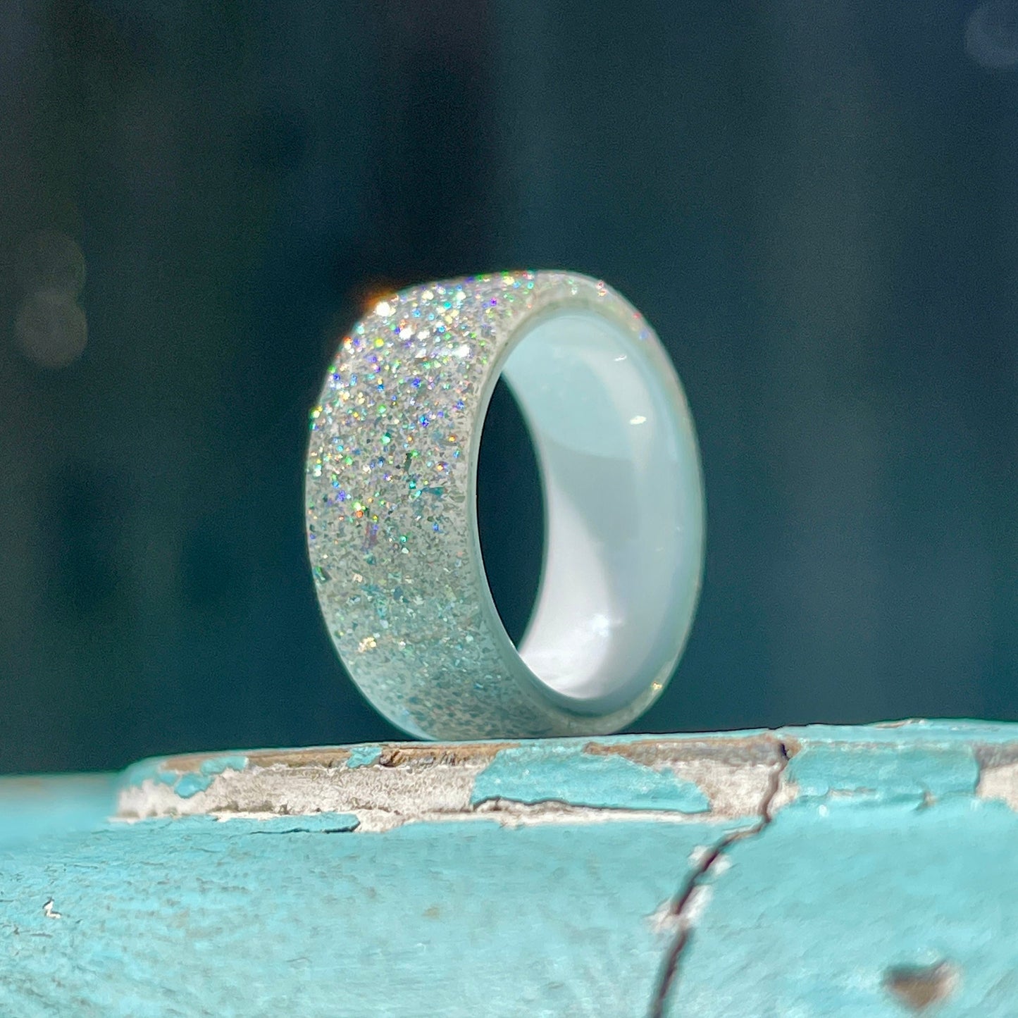 Moissanite DiamondCast Ring on a White Ceramic Band